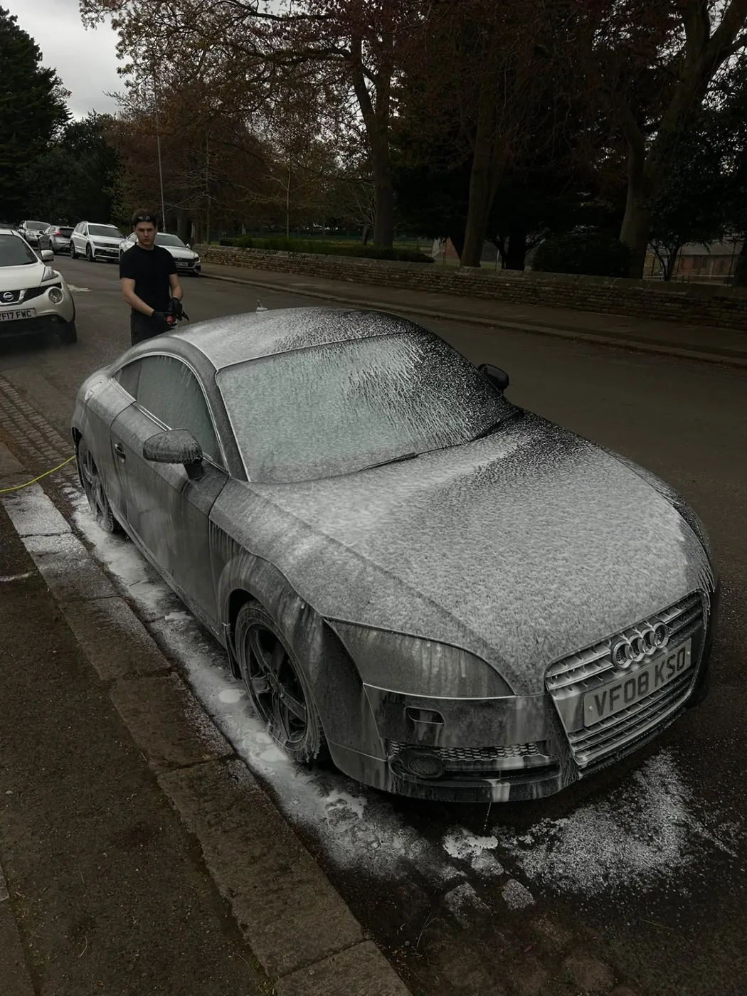Audi TT covered in snow foam on a Northamptonshire street